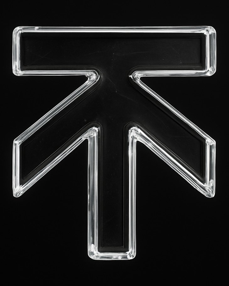 The Kweku Tanga upward arrow mark, cast in clear glass
