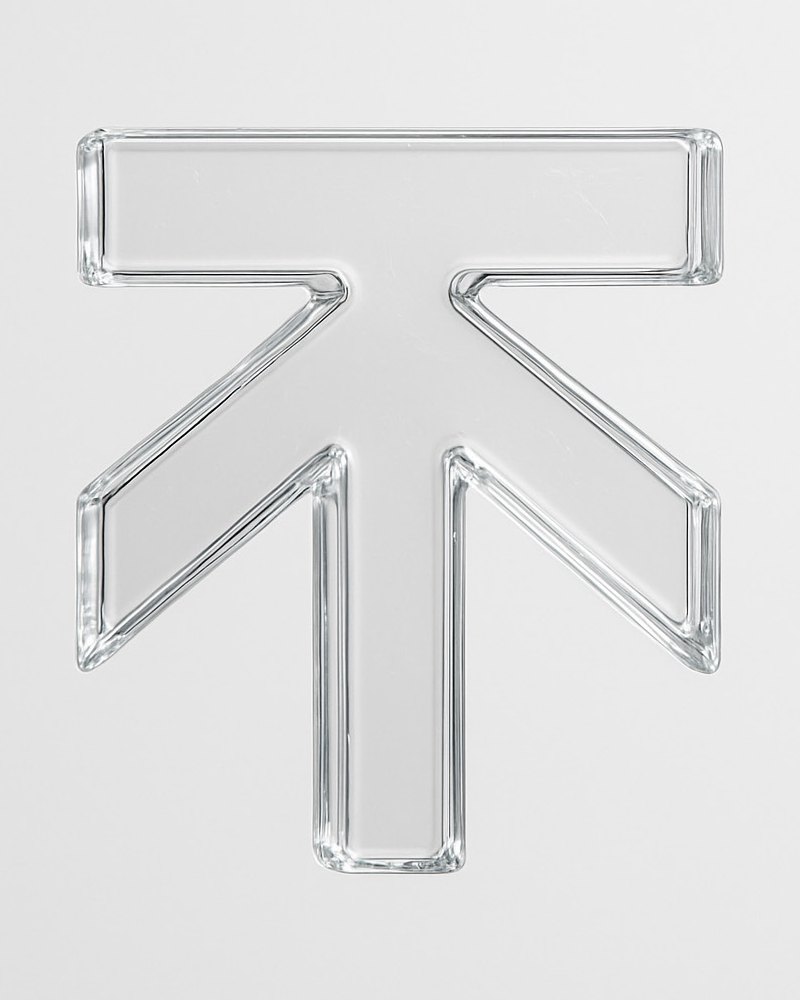 The Kweku Tanga upward arrow mark, cast in clear glass